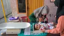 Program ini meliputi Imunisasi Tambahan ORI Campak untuk anak usia 9 bulan hingga 7 tahun. (Juni KRISWANTO/AFP)