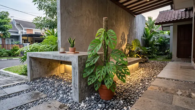 Ide Teras Rumah dengan Meja Semen dan Tanaman Monstera