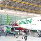 Pesawat Citilink yang merubah warna dibagian belakang pesawat di Bandara Soetta, Tangerang,(6/11/2015). Pesawat Citilink-Kapal Api tersebut akan terbang mengelilingi nusantara dimana akan membawa aroma kopi Kapal Api. (Liputan6.com/Angga Yuniar)