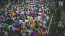 Ribuan pelari mengikuti Jakarta Marathon 2018 di Gelora Bung Karno, Jakarta, Minggu (28/10). Ada lima nomor lari, yakni marathon (42,195 km), half marathon (21 km), 10 K, 5K, dan maratoonz (lari untuk anak-anak). (Liputan6.com/Faizal Fanani)