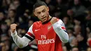 Gelandang Arsenal Alex Oxlade-Chamberlain berselebrasi setelah mencetak gol keduanya saat laga pertandingan sepak bola Liga Inggris antara Arsenal melawan Crystal Palace di Stadion Emirates, London, pada (02/02/14) waktu Setempat. (Foto: AFP/Ben Stansall)