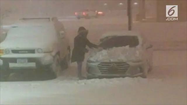 Badai salju dan angin kencang melanda sejumlah wilayah Amerika Serikat, khususnya negara bagian Iowa.