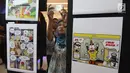 Pengunjung menggunakan ponsel mengambil gambar karya-karya foto pemenang Anugerah Jurnalistik Polri 2018 di Gandaria City, Jakarta, Rabu (18/7). Anugerah Jurnalistik 2018 ini bertema Bersama Polri Wujudkan Pilkada Damai 2018. (Liputan6.com/Arya Manggala)