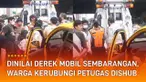 Warga membela pengemudi mobil dan menilai upaya derek dinilai sembarangan.