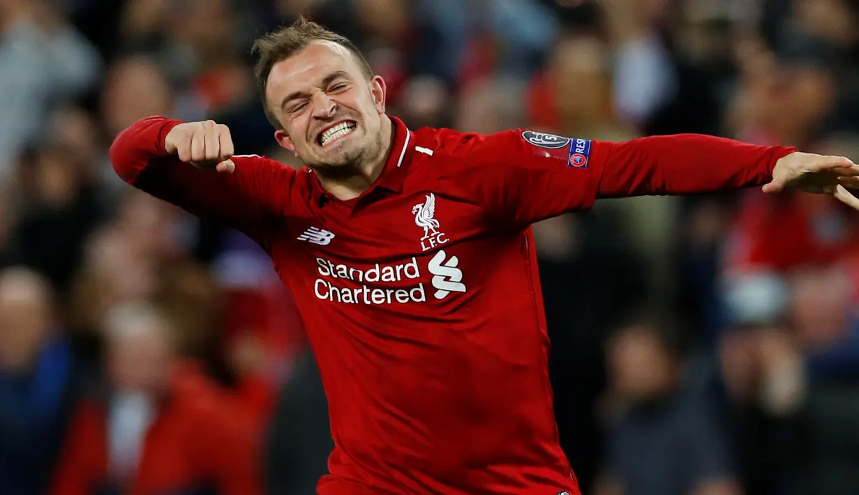 Gelandang Liverpool, Xherdan Shaqiri berselebrasi setelah akhir laga kedua semifinal Liga Champions 2018/19, melawan Barcelona di Anfield, Selasa (7/5/2019).  Liverpool sukses melaju ke final Liga Champions usai tampil sensasional menghajar Barcelona 4-0. (REUTERS/Phil Noble)