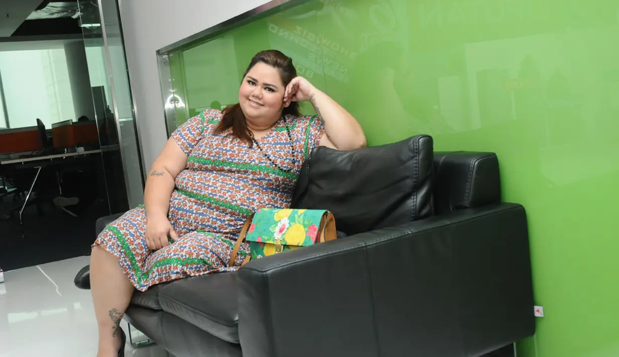 Meski memiliki berat badan di atas rata-rata (125 kg), Jelita Clarisa Ramlan, mengaku tidak pernah mempermasalahkan hal tersebut, (16/7/2014). (Liputan6.com/Helmi Fithriansyah)