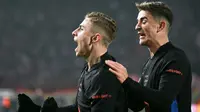 Gelandang Barcelona asal Spanyol #16, Fermin Lopez (kiri), merayakan golnya bersama gelandang Barcelona asal Spanyol #06, Pablo Gavi, dalam laga pekan ke-4 Liga Champions UEFA antara Crvena Zvezda Beograd dan FC Barcelona, di Stadion Rajko-Mitic, Beograd, pada 6 November 2024. (Andrej ISAKOVIC/AFP)