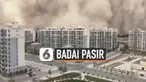 Badai pasir yang tebal menerjang daerah Donhuang China hari Minggu (25/7). Gedung-gedung kota itu diselimuti pekatnya pasir dan debu yang berwarna cokelat tua.