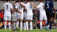 Pemain Real Madrid merayakan gol yang di cetak Jesé Rodríguez ke gawang Inter Milan dalam International Champions Cup di Guangzhou, Tiongkok. (27/7/2015). (AFP Photo/Johannes Eisele)