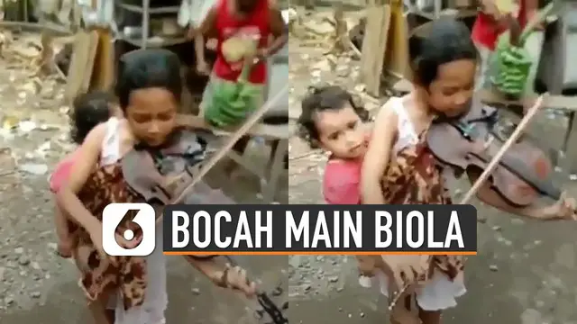 VIDEO: Viral Bocah Gendong Adik Sambil Main Biola