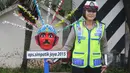 Seorang polwan anggota Ditlantas Polda Metro Jaya saat apel Gelar Pasukan Ops Simpatik Jaya 2015 di Lapangan Ditlantas Polda Metro Jaya, Rabu (1/4/2015). (Liputan6.com/Herman Zakharia)