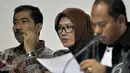 Ekspresi Romi Herton dan Istrinya Masyitoh saat menjalani sidang lanjutan di Pengadilan Tipikor, Jakarta, Kamis (4/12/2014). (Liputan6.com/Miftahul Hayat)