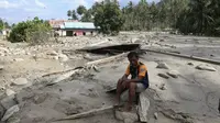 Kondisi pascabanjir lumpur dan batu di Desa Poi, Sigi pada Jumat (15/5/2020). Sebanyak 45 rumah warga tertimbun lumpur, 5 di antaranya tertimbun seluruhnya. (Foto: Liputan6.com/ Heri Susanto).