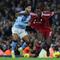 Penyerang Manchester City, Omar Marmoush (kiri) menarik baju bek Liverpool, Ibrahima Konate (kanan) selama pertandingan sepak bola Liga Primer Inggris antara Manchester City dan Liverpool di Stadion Etihad di Manchester, barat laut Inggris, pada 9 November 2025. (Darren Staples / AFP)
