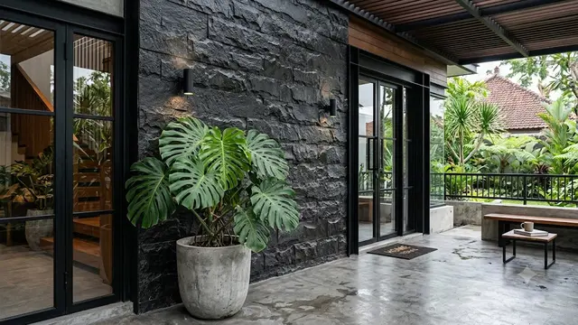 Ide Teras Dinding Batu Tempel dan Monstera