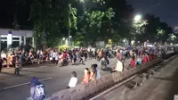 Suasana car free night di Jalan MH Thamrin pada saat malam pergantian tahun. (Liputan6.com/Anendya Niervana)