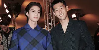 Dalam acara tersebut, aktor Thailand ini pun bersanding dengan pemain bola asal Korea Son Heung Min yang mengenakan coat hitam bermotif. [@cloud9.ent.official]