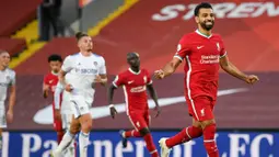 Penyerang Liverpool, Mohamed Salah berselebrasi setelah mencetak gol keempat timnya ke gawang Leeds United pada laga pekan pertama Premier League di Stadion Anfield, Sabtu (12/9/2020). Mo Salah mencetak hattrick saat membawa Liverpool menang 4-3 atas Leeds United. (Shaun Botterill, Pool via AP)