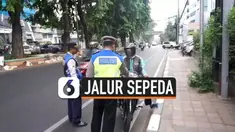 Petugas Dishub dan kepolisian melakukan sterilisasi jalur sepeda di Tomang Jakarta Barat. 35 pengendara motor dan mobil ditilang karena melewati jalur sepeda.