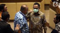 Menteri Dalam Negeri Tito Karnavian saat rapat kerja dengan Komisi II DPR di Kompleks Parlemen, Jakarta, Rabu (24/6/2020). Rapat membahas pendahuluan RAPBN TA 2021, rencana kerja pemerintah, serta upaya dan kinerja pemerintah daerah dalam menangani pandemi COVID-19. (Liputan6.com/Johan Tallo)