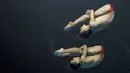 Atlet loncat indah China saat tampil pada nomor sinkronisasi 10 meter platform Asian Games XVIII di Stadion Aquatic Senayan, Jakarta, Rabu (29/8/2018). (Bola.com/Vitalis Yogi Trisna)