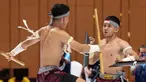 Atlet Kun Bokator putra Indonesia, Gema Nur Arifin dan Yazid Hanifam Kurniawan, bertanding dalam nomor Men's Duo Group Performance Kun Bokator SEA Games 2023 di Chrouy Changvar Convention Center, Phnom Penh, Kamboja, Senin (8/5/2023). (Bola.com/Abdul Aziz)