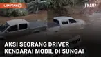 Aksi seorang driver mengendarai mobil di dalam sungai mengundang perhatian