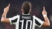 Pemain Juventus, Paulo Dybala merayakan gol ke gawang AC Milan pada laga Serie A di Allianz Stadium, Turin, (31/3/2018). Juventus menang 3-1. (Alessandro Di Marco/ANSA via AP)