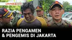 Pengamen berkostum badut mencoba kabur saat Satpol PP menggelar razia penyandang masalah kesejahteraan sosial (PMKS) di sekitar kawasan Senen, Jakarta Pusat pada Rabu siang. Razia digelar karena adanya laporan pengamen dan pengemis yang kerap memaksa...