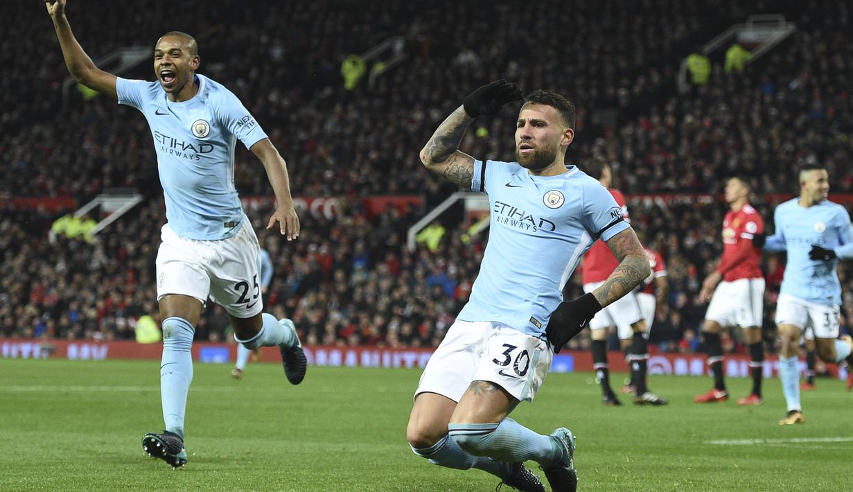 Satu golnya ke gawang Manchester United menambah pundi-pundi gol bek subur Manchester City, Nicolas Otamendi. Gol tersebut membuat dirinya berada pada urutan keenam top scorer klub dengan torehan lima gol. (AFP/Oli Scarff)