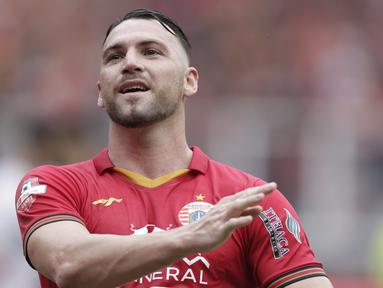 Striker Persija Jakarta, Marko Simic, melakukan selebrasi usai membobol gawang Borneo FC pada laga Shopee Liga 1 di SUGBK, Jakarta, Minggu, (1/3/2020). Persija menang 3-2 atas Borneo FC. (Bola.com/M Iqbal Ichsan)