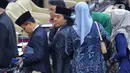 Komedian, Alfiansyah atau Komeng (tengah) usai rapat paripurna pelantikan anggota Parlemen Republik Indonesia terpilih periode 2024-2029 di Gedung Nusantara, Kompleks Parlemen, Senayan, Jakarta, Selasa (1/10/2024). Alfiansyah atau Komeng terpilih menjadi anggota Dewan Perwakilan Daerah (DPD) RI dari Provinsi Jawa Barat. (Liputan6.com/Angga Yuniar)