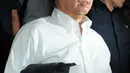 Ekspresi RJ Lino usai menjalani pemeriksaan Bareskrim, Jakarta, Kamis (28/1/2016). RJ Lino diperiksa untuk kelima kalinya sebagai saksi perkara dugaan korupsi pengadaan mobile crane. (Liputan6.com/Helmi Affandi)