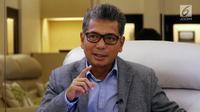 Direktur Utama Pegadaian Sunarso berpose usai diwawancara oleh Liputan6.com di Kantor Pusat Pegadaian, Jakarta, Rabu (11/4). (Liputan6.com/Arya Manggala)
