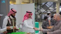 Bagi-bagi air zam-zam bagi jemaah haji 2023 yang naik kereta cepat ke Madinah. Dok: Saudi Press Agency (SPA) via Arab News
