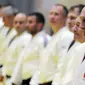 Presiden Rusia, Vladimir Putin mengambil bagian dalam sesi latihan judo bersama atlet nasional Rusia di Sochi, Kamis (14/2). Judo merupakan salah satu olahraga kegemaran Putin yang telah digeluti sejak masa muda. (Mikhail KLIMENTYEV/SPUTNIK/AFP)