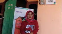 Ulfa (40) warga Serang Banten‎  y‎ang mendapat sambungan listrik gratis dengan daya 450 Volt Amper (VA).