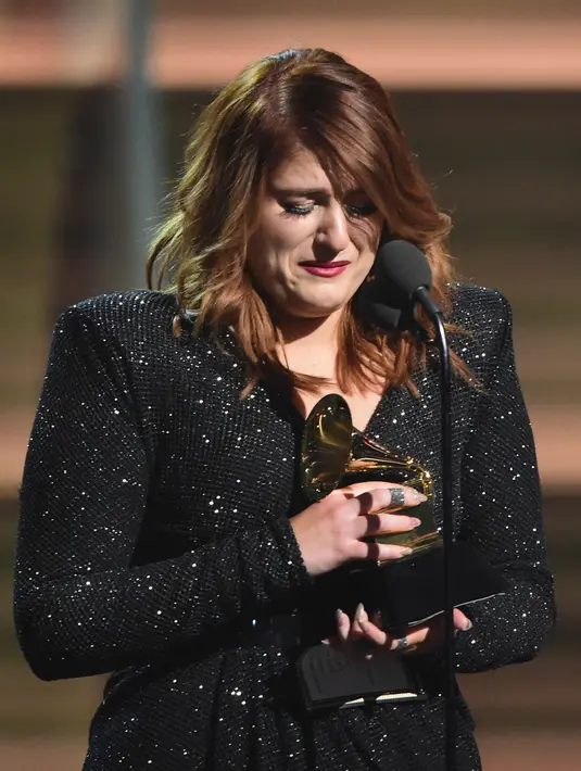 Kepada ‘Entertainment Tonight’ Meghan Mengatakan  jika sang ayah merupakan sosok yang ‘funky’ dan penuh perasaan. Ia mengingat ketika kecil sering bermain di kolam renang di mana ayahnya melempar banyak bola disko. (AFP/Bintang.com)