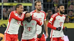 Gol-gol kemenangan Bayern Munchen di laga ini dicetak oleh Dayot Upamecano dan sumbangan hattrick Harry Kane. (INA FASSBENDER / AFP)