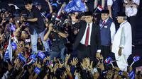 Anies Baswedan sampaikan dalam pidato politiknya saat menghadiri acara relawan Amanat Indonesia (ANIES) di Tenis Indoor, Kompleks Gelora Bung Karno (GBK), Senayan, Jakarta Pusat, Minggu (7/5/2023). (Liputan6.com/Johan Tallo)