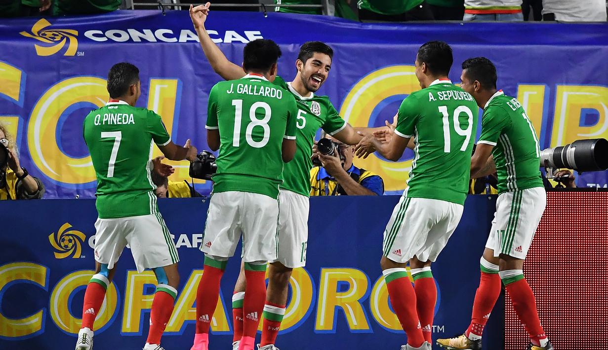 Meksiko menjadi salah satu negara di Benua Amerika yang lolos ke Piala Dunia 2018 setelah menjadi juara grup pada zona CONCACAF dengan meraih 21 poin dari 6 kali menang pada laga kualifikasi. (Norm Hall/Getty Images/AFP)