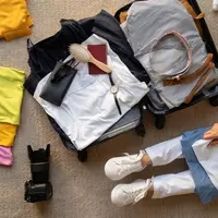 Tips Agar Tidak Bawa Banyak Baju Saat Traveling (Foto/Sumber: Freepik)