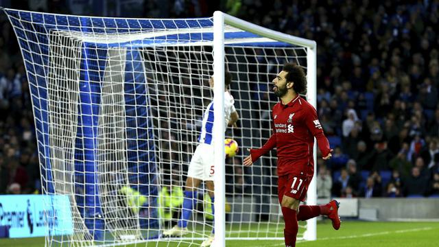 Gelandang Liverpool, Mohamed Salah, merayakan gol yang dicetaknya ke gawang Brighton. (AP/Gareth Fuller)