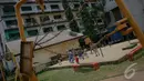 Sejumlah anak asyik bermain 'Rebutan Tempat' di area Rusunawa Sidang, Jakarta, Jumat (19/9/2014) (Liputan6.com/Faizal Fanani)
