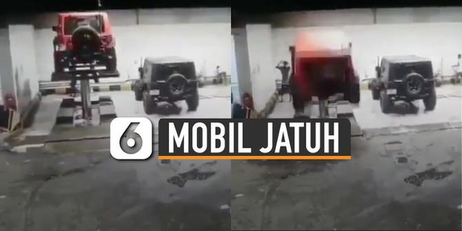 VIDEO: Duh, Mobil Jeep Jatuh dari Hidrolik Saat Dicuci