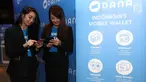 Dua wanita menggunakan DANA, Dompet Digital Indonesia di Jakarta, Rabu(21/3). DANA, Dompet Digital Indonesia merupakan sebuah layanan dari perusahaan rintisan (start up) di bidang teknologi finansial. (Liputan6.com/Angga Yuniar)