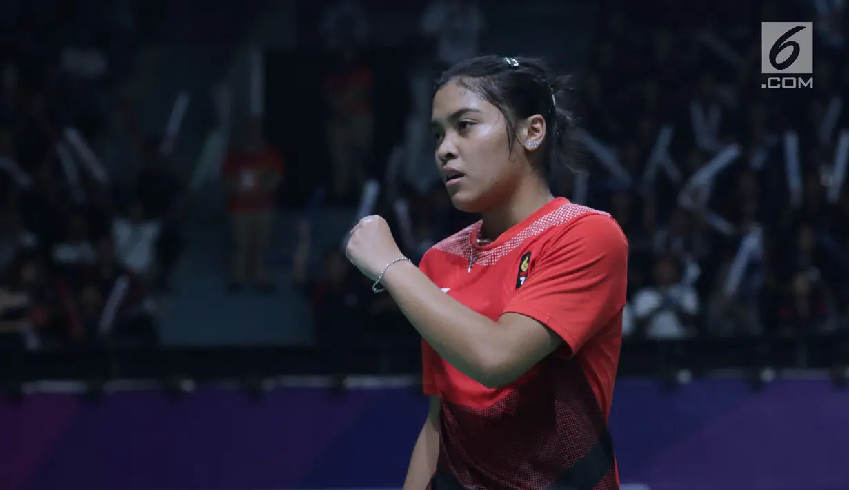 Tunggal putri Indonesia, Gregoria Mariska Tunjung merayakan poin saat melawan pemain Jepang, Akana Yamaguchi pada semifinal Bulutangkis Beregu Putri Asian Games 2018 di Jakarta, Selasa (21/8). (Liputan6.com/Helmi Fithriansyah)