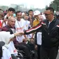 Menpora Imam Nahrawi mewakili Presiden RI melepas peserta Funwalk Bersama Kaum Difabel, di Area Car Freeday FX Sudirman, Jakarta, Minggu (8/9).