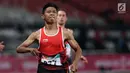 Atlet para-atletik Indonesia, Sapto Yogo Purnomo usai laga lari nomor 100 meter T37 pria yang  digelar di Stadion GBK, Jakarta, Selasa (9/10). Ini menjadi medali emas kedua Sapto di Asian Para Games 2018. (Liputan6.com/Helmi Fithriansyah)