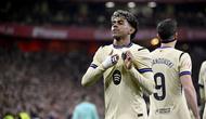 Penyerang Barcelona, Lamine Yamal, merayakan gol yang dicetaknya ke gawang Athletic Club dalam laga jornada 27 La Liga Spanyol 2025/2026 di San Mames Stadium, Bilbao, Minggu (8/3/2026) dini hari WIB. (ANDER GILLENEA / AFP)